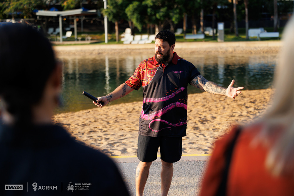 A Larrakia Elder providing a Saltwater Ceremony at the Darwin Waterfront Precinct Lagoon