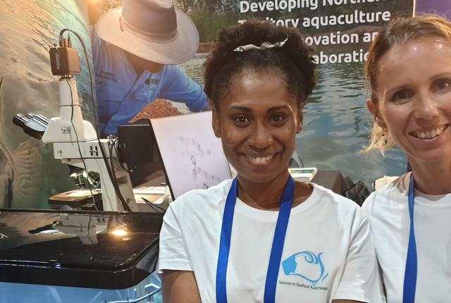 Delegates at an exhibition booth