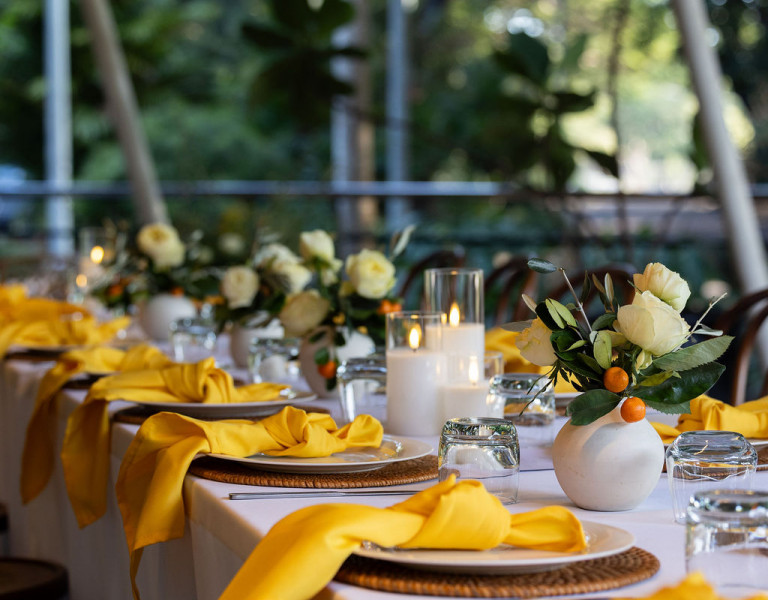 Italian Theme table setting and flower arrangements for private event at Eva's Cafe