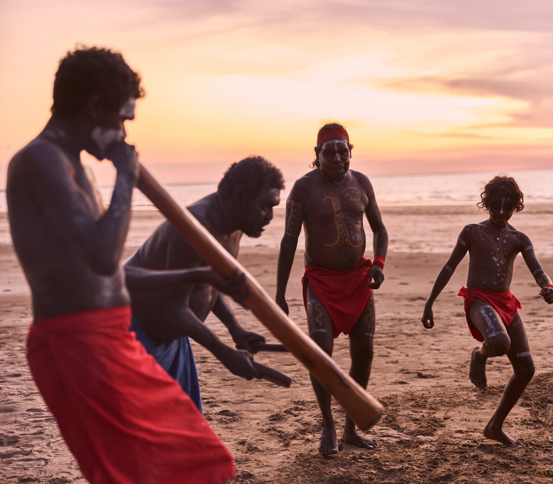Aboriginal cultural performance on the beach including didgeridoo and dancing 