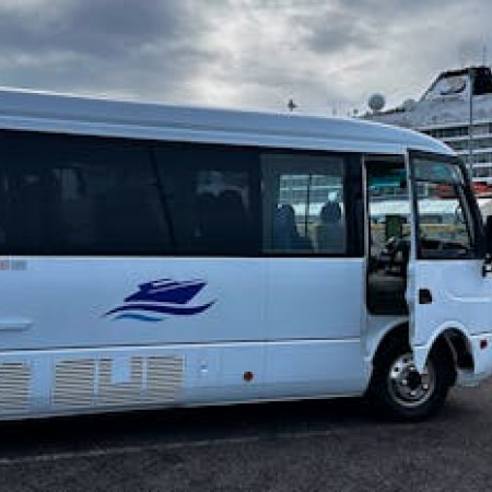 Bus facing forward, providing transport to delegates