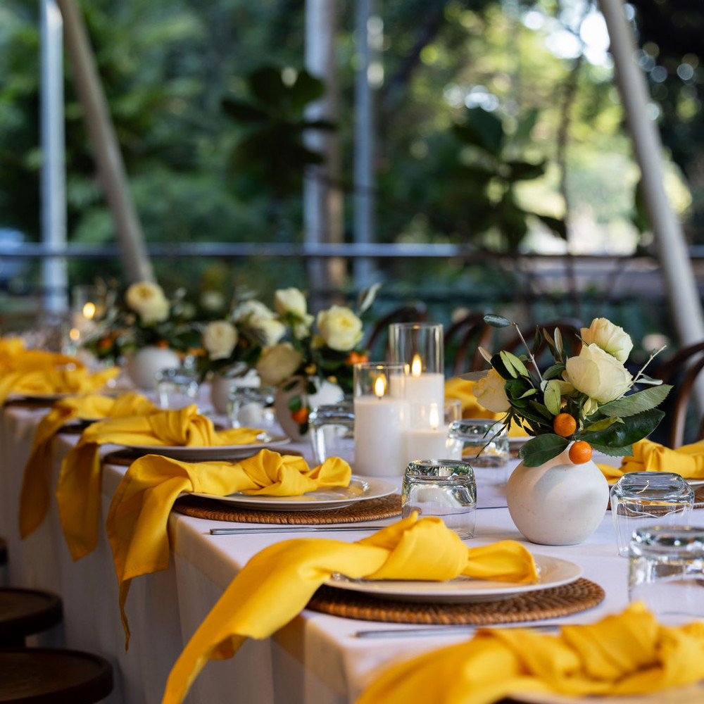 Italian Theme table setting and flower arrangements for private event at Eva's Cafe