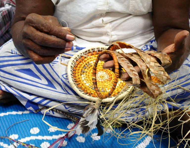 Close up of person weaving 