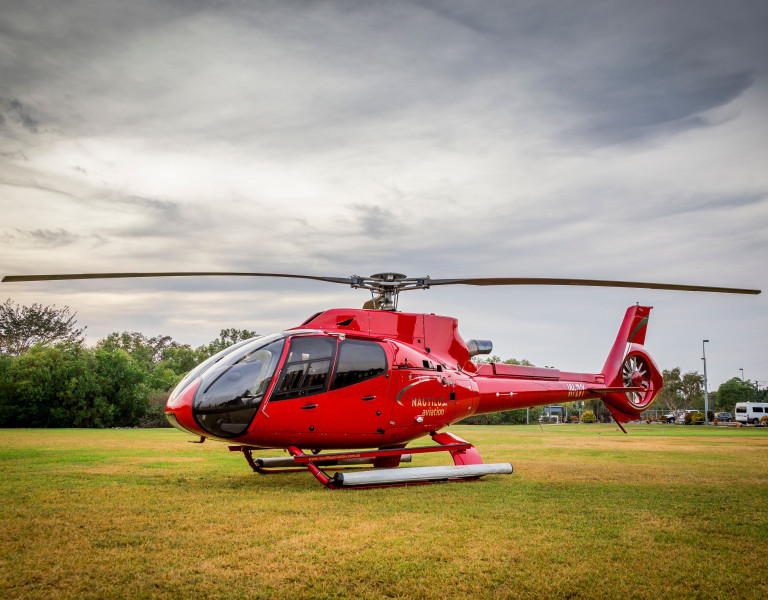 red helicopter on the ground