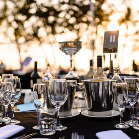 Glassware set at at table for outdoor function
