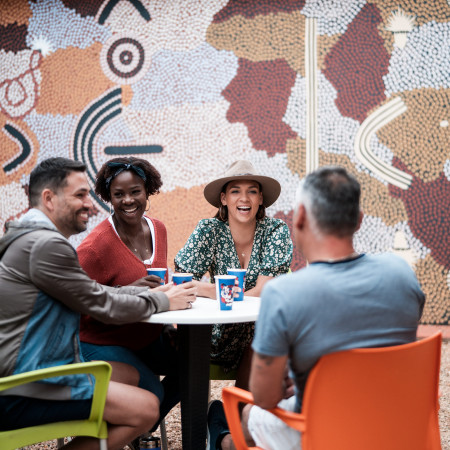 group gathered outside mural at Araluen Arts Centre