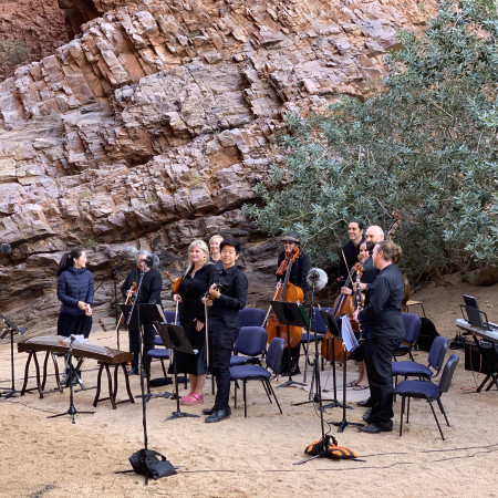 Orchestra setup in desert landscape