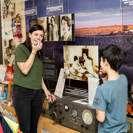 Clients at radio at Alice Springs School of the Air Visitor Centre
