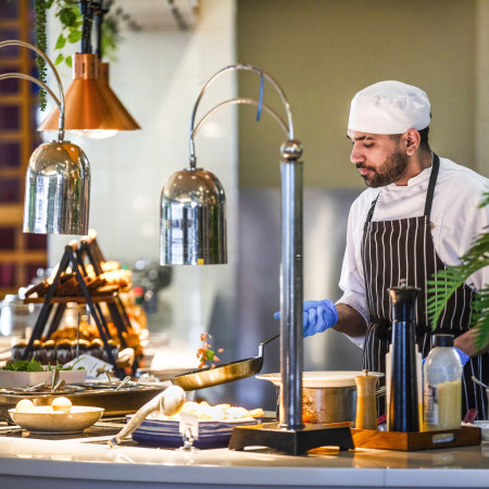 Chef preparing breakfast at Tali Restaurant 