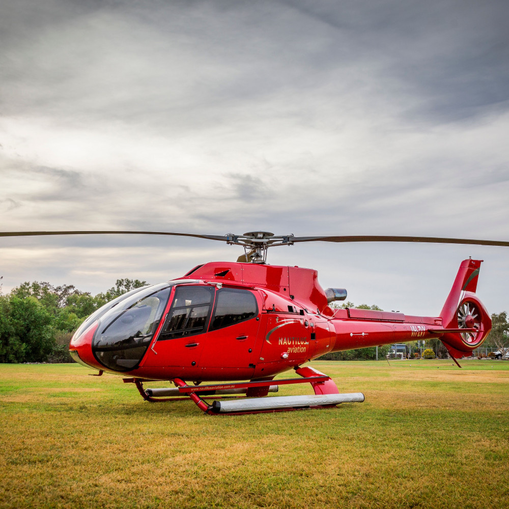 red helicopter on the ground
